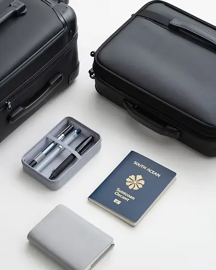 Suitcase, passport and travel items prepared for an overseas journey